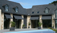 Load image into Gallery viewer, Drop Arm Awning Mounted To House