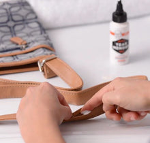 Load image into Gallery viewer, Tear Mender Instant Fabric Adhesive Applied To Purse